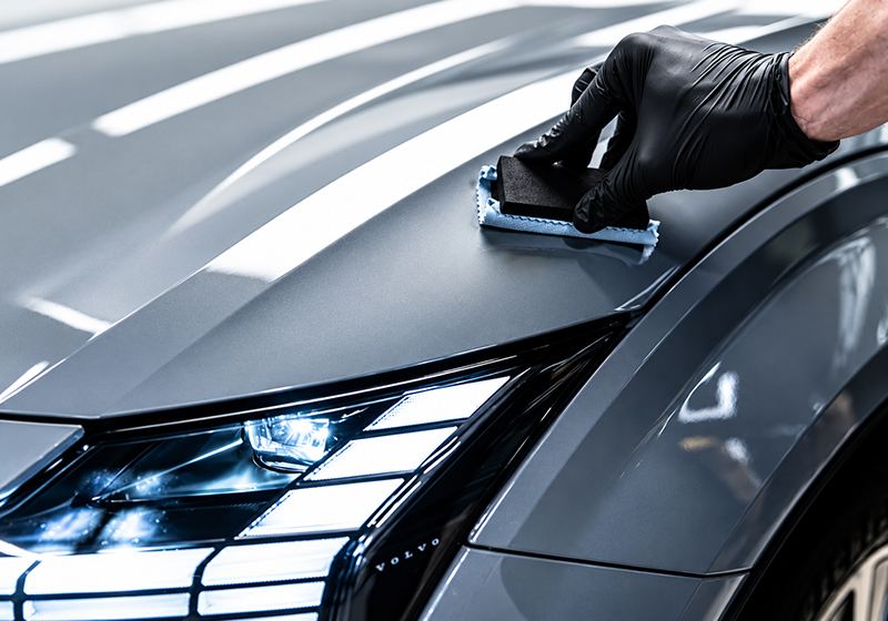 Graphene coating being applied to a car bonnet
